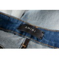#828 Amiri letter print cashew patch jeans blue